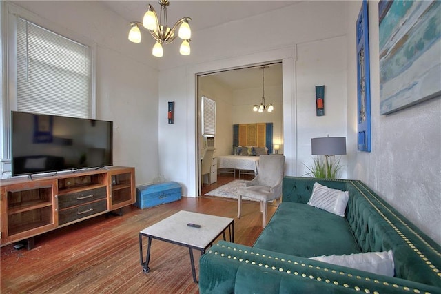 living room featuring hardwood / wood-style flooring and a chandelier