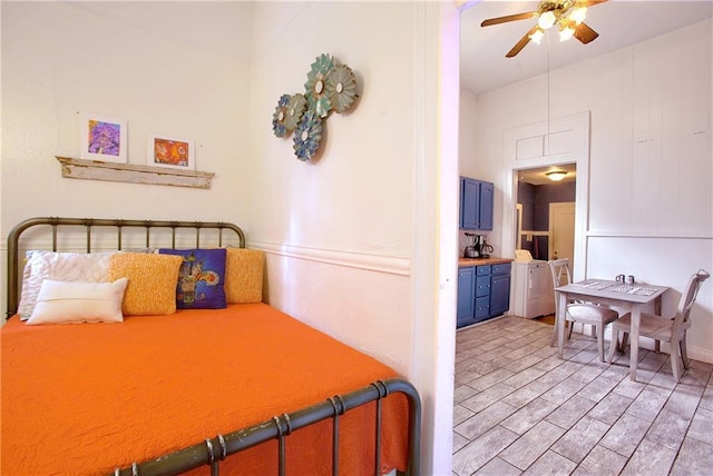 312931 N Claiborne Ave, New Orleans, LA 70117 - bedroom with ceiling fan, light wood-style flooring, and washing machine and dryer