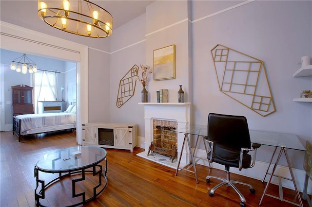 office space with hardwood / wood-style flooring and a notable chandelier