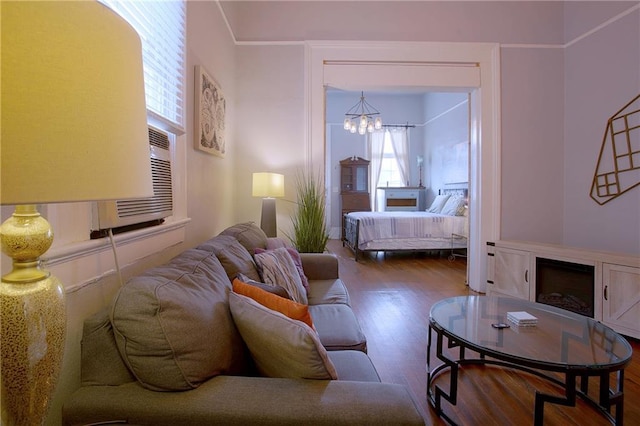 bedroom with wood-type flooring and a notable chandelier