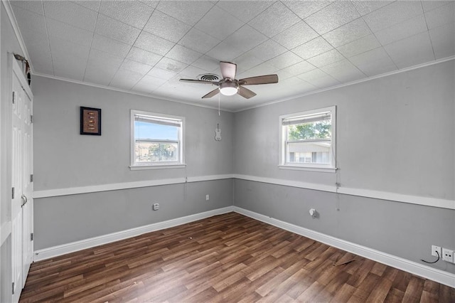 spare room with ceiling fan, ornamental molding, and a wealth of natural light