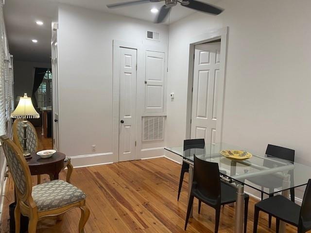 dining space featuring ceiling fan and wood-type flooring