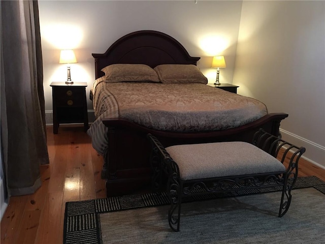 bedroom with wood-type flooring