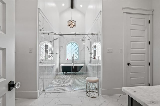 entryway featuring a chandelier and high vaulted ceiling