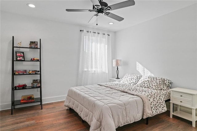 bedroom with ceiling fan and dark wood-type flooring