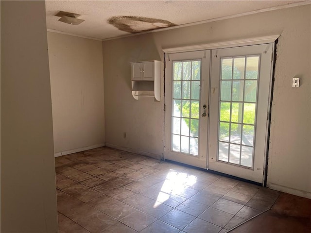 doorway with tile patterned floors, a textured ceiling, and french doors