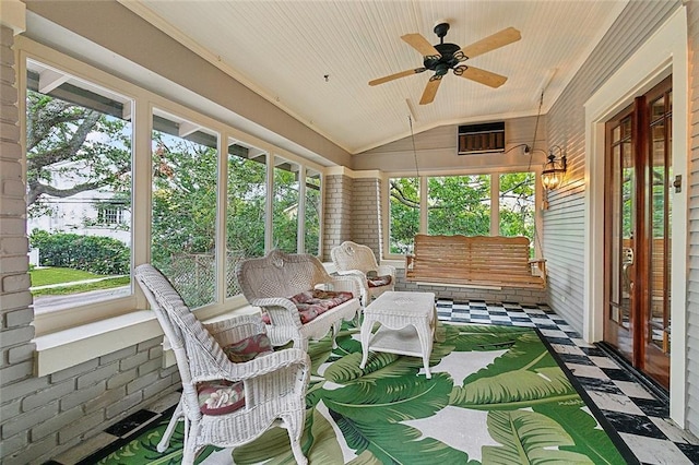 sunroom featuring vaulted ceiling and ceiling fan