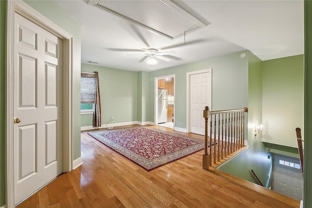 interior space featuring ceiling fan and hardwood / wood-style floors