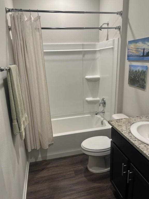 full bathroom featuring wood-type flooring, vanity, toilet, and shower / bath combination with curtain