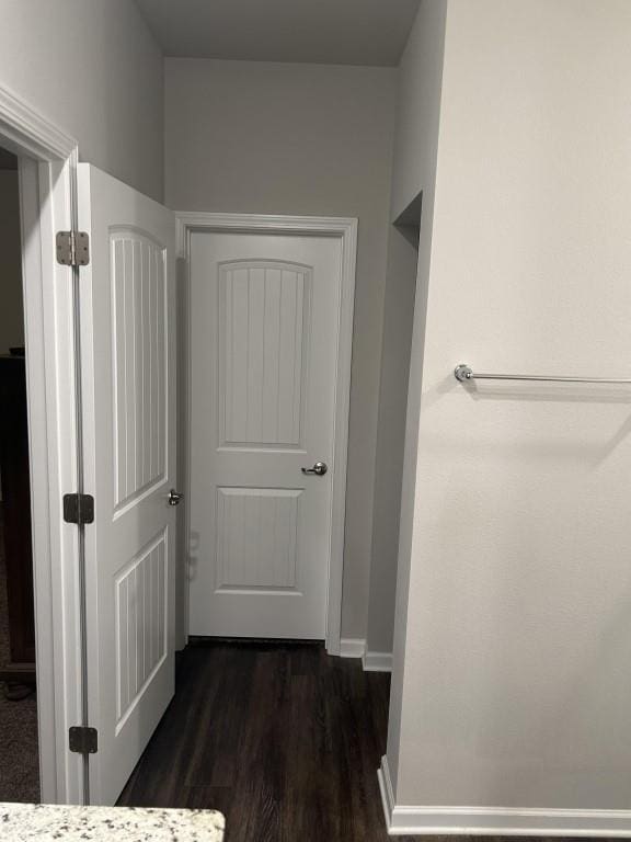 hall with dark hardwood / wood-style flooring