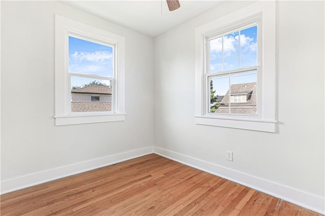 unfurnished room featuring ceiling fan and wood-type flooring