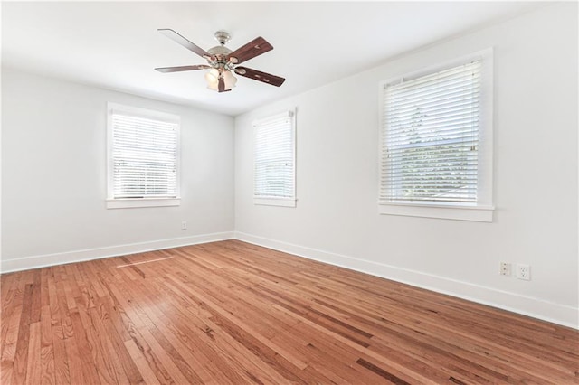 spare room featuring ceiling fan and hardwood / wood-style flooring