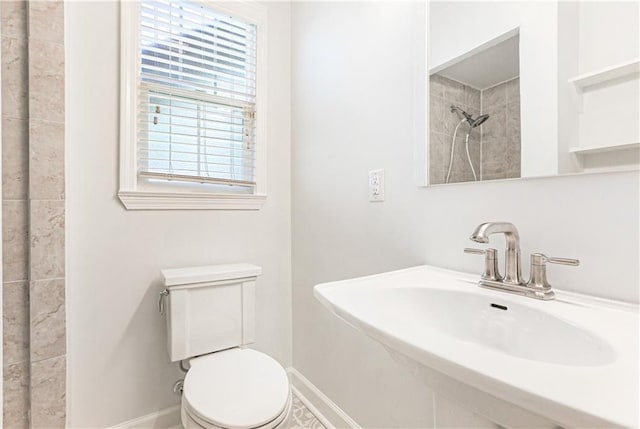 bathroom featuring toilet and sink