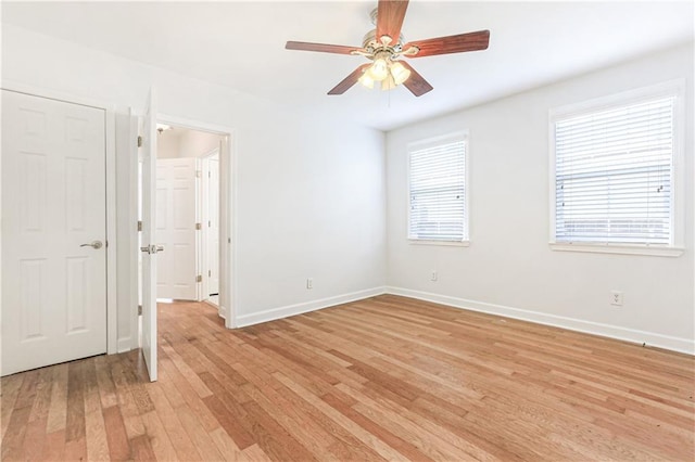 spare room with ceiling fan and light hardwood / wood-style flooring