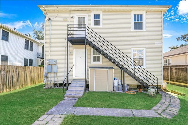 rear view of house with a lawn