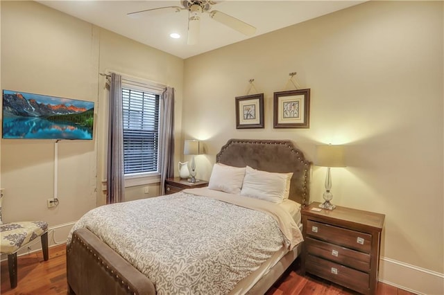 bedroom with ceiling fan and hardwood / wood-style flooring