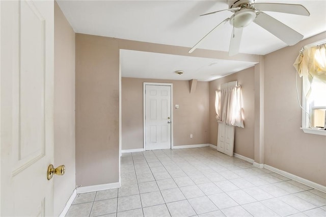 unfurnished room featuring ceiling fan and light tile patterned flooring