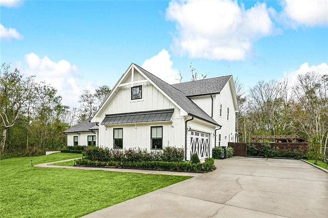 view of front facade with a front yard and a garage