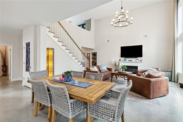 dining area featuring plenty of natural light and a chandelier