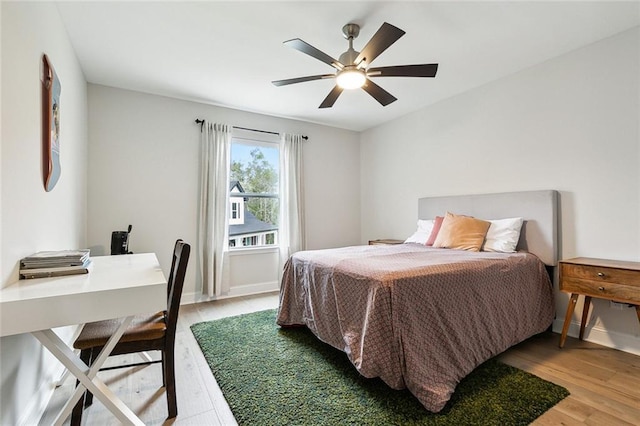 bedroom featuring ceiling fan and hardwood / wood-style floors