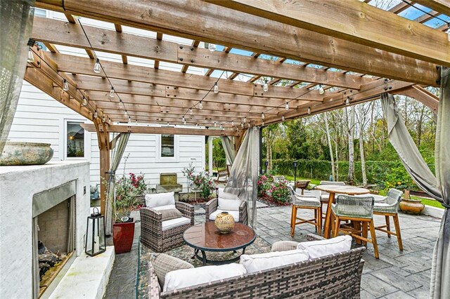 view of patio / terrace with grilling area, exterior kitchen, and a hot tub