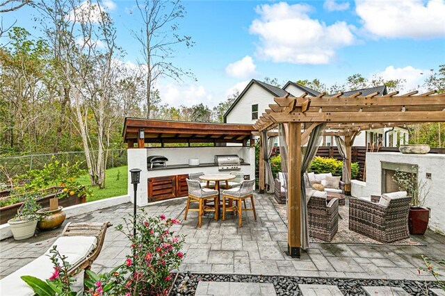 view of patio with an outdoor living space with a fireplace and a pergola