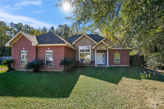 ranch-style home with a front lawn