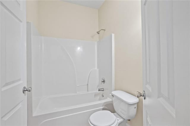 bathroom with toilet and shower / bath combination