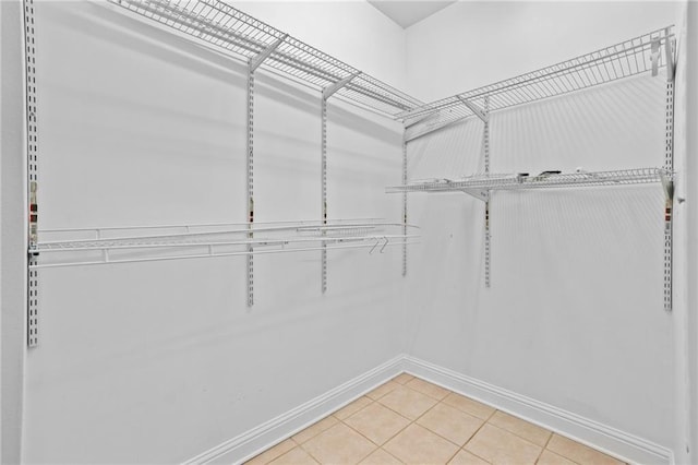 spacious closet featuring tile patterned floors