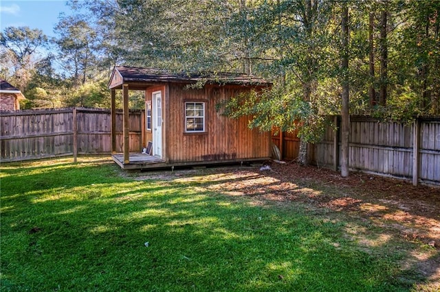 view of outbuilding with a yard