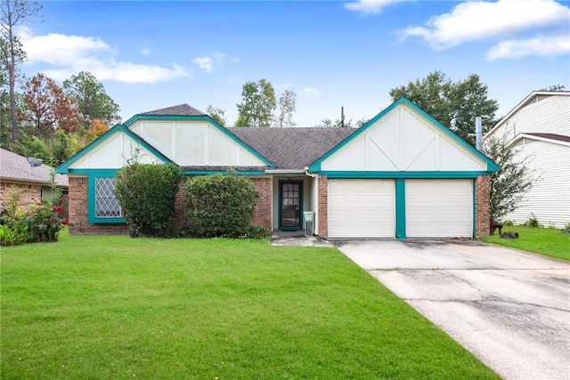 view of front of home with a front yard and a garage