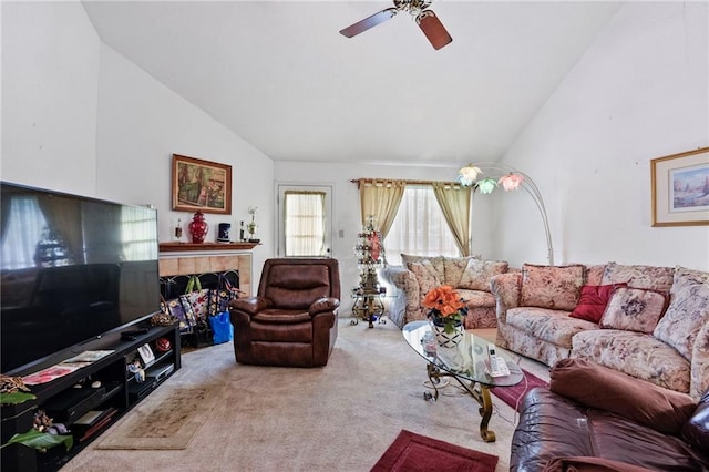 carpeted living room with ceiling fan and high vaulted ceiling