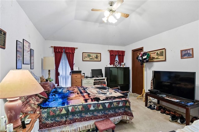 carpeted bedroom featuring ceiling fan and vaulted ceiling