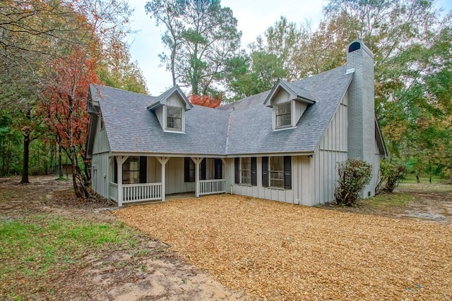 cape cod-style house with a porch