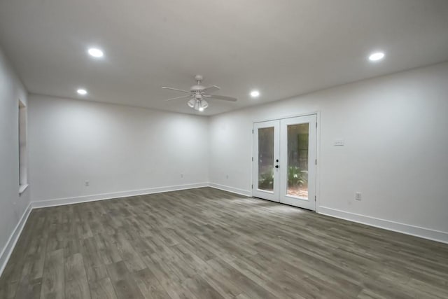 unfurnished room featuring ceiling fan, french doors, and dark wood-type flooring