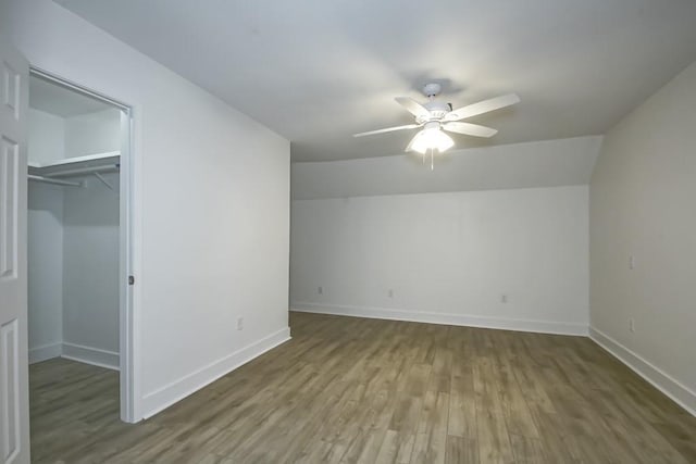 bonus room featuring hardwood / wood-style flooring, ceiling fan, and vaulted ceiling