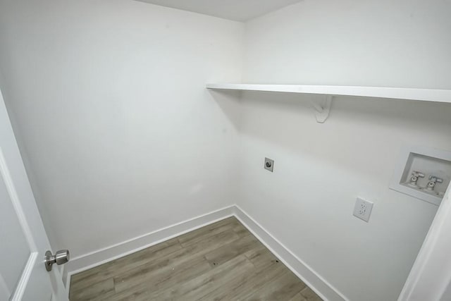 laundry room featuring hardwood / wood-style floors, hookup for a washing machine, and electric dryer hookup