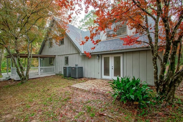 rear view of property featuring central air condition unit and french doors