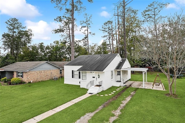 back of property featuring a lawn, cooling unit, and a patio