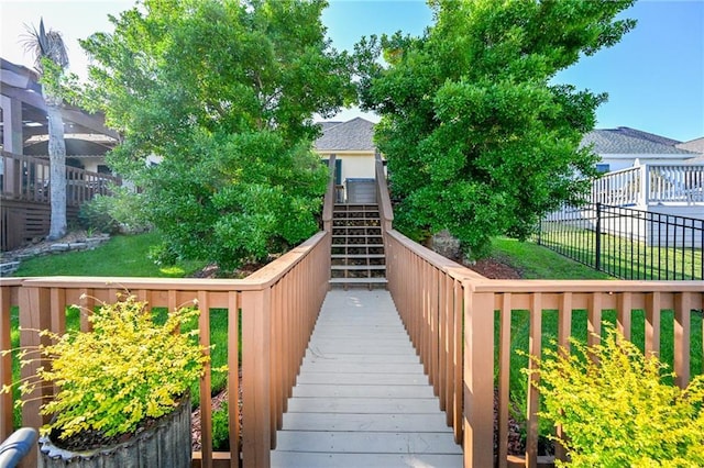 view of home's community with a yard