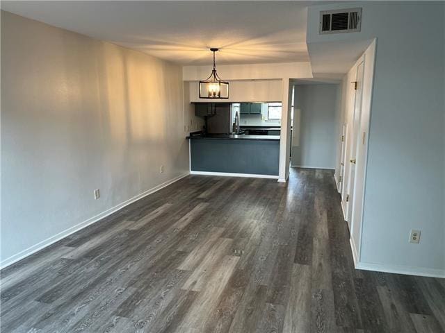 interior space with dark hardwood / wood-style flooring