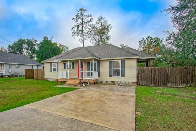 ranch-style house with covered porch and a front yard