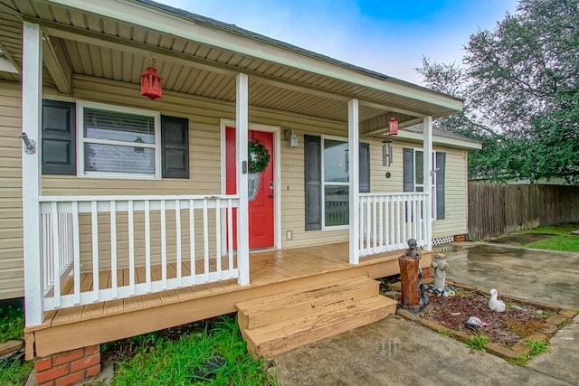 doorway to property featuring covered porch