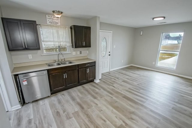 kitchen with dishwasher, light hardwood / wood-style floors, dark brown cabinets, and sink