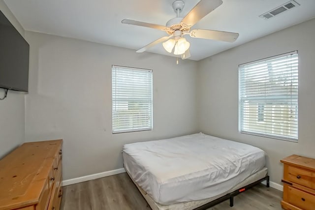 bedroom featuring ceiling fan and light wood-type flooring