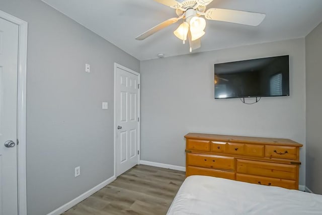 bedroom featuring light hardwood / wood-style flooring and ceiling fan