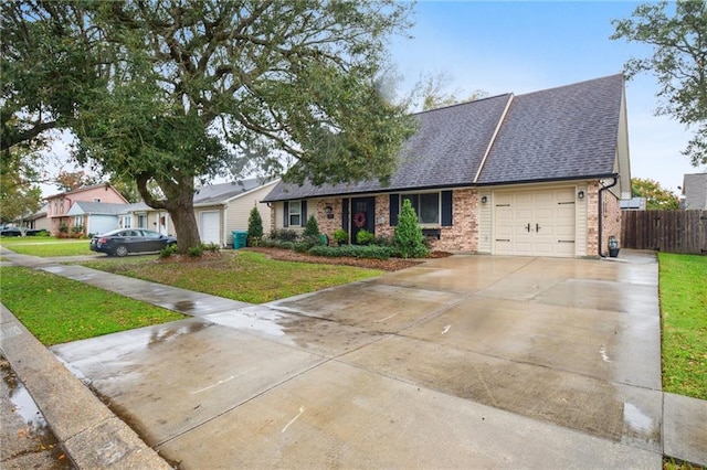 ranch-style home with a front lawn and a garage