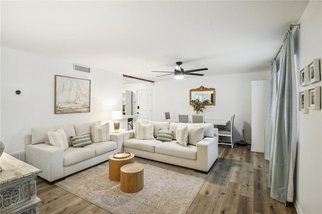 living room with hardwood / wood-style floors and ceiling fan