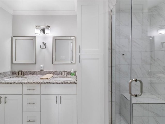 bathroom with crown molding, a shower with door, and vanity