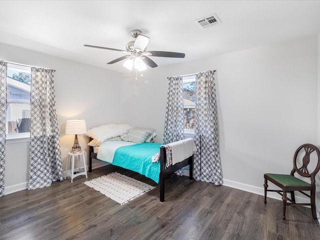 bedroom featuring dark hardwood / wood-style floors and ceiling fan